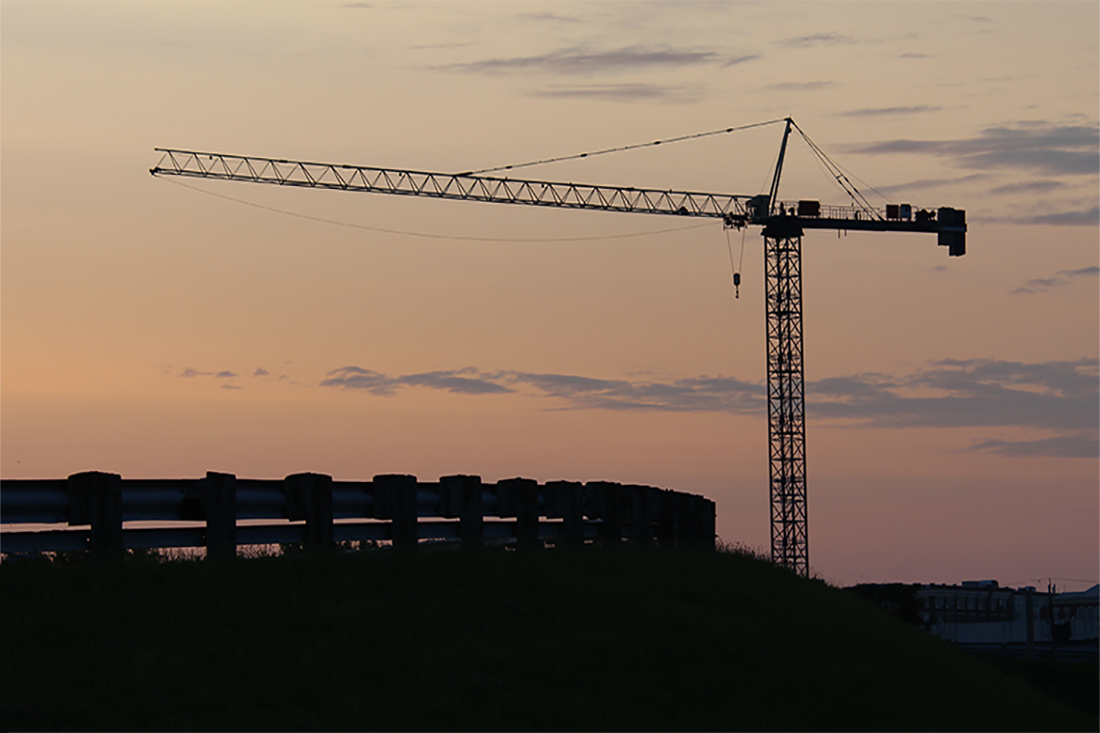 beautiful sunset behind a crane in brantford, ontario